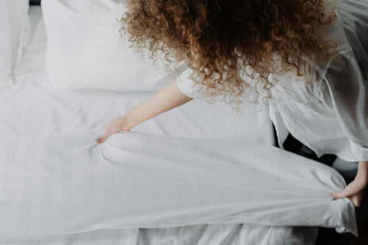 Person sleeping at night representing the breathing challenges faced by sleep apnea patients - Mattress Miracle Brantford
