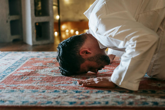 Person in peaceful prayer before bedtime - Mattress Miracle Brantford