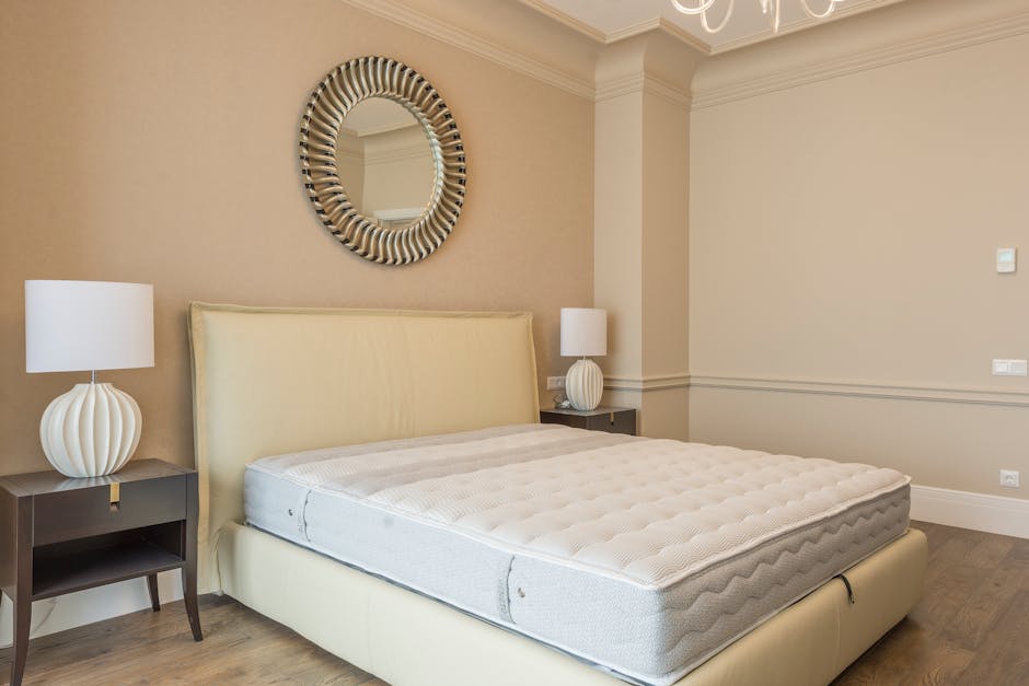 Mattress on bed frame in elegant bedroom setting
