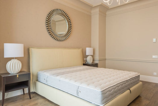 Mattress on bed frame in elegant bedroom setting