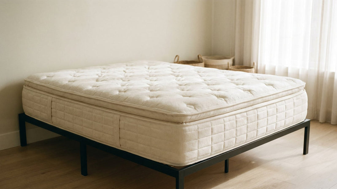 Quilted-top mattress on a frame in a neutral review setting - Mattress Miracle Brantford