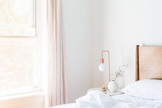 Bright minimalist Scandinavian bedroom with IKEA-style mattress