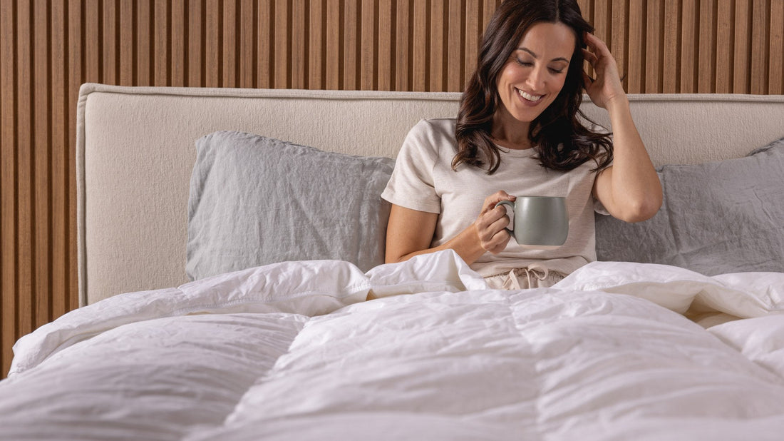 Woman having morning coffee on a Logan and Cove Pinnacle mattress - Mattress Miracle Brantford