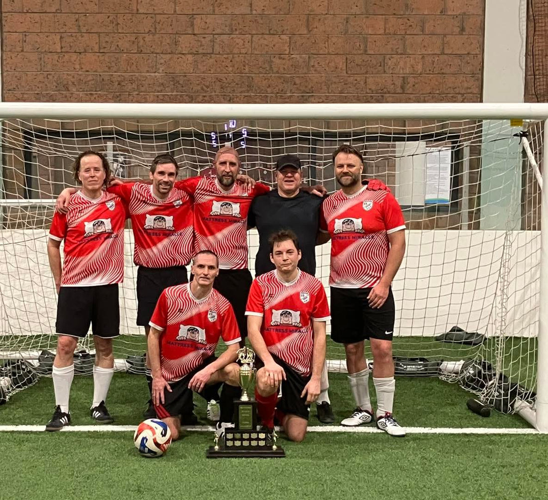 Mattress Miracle soccer team with 2026 Brantford Over 35 Indoor Soccer championship trophy