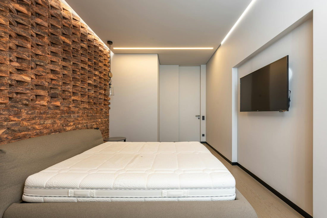 New mattress in a box being unboxed in a modern bedroom