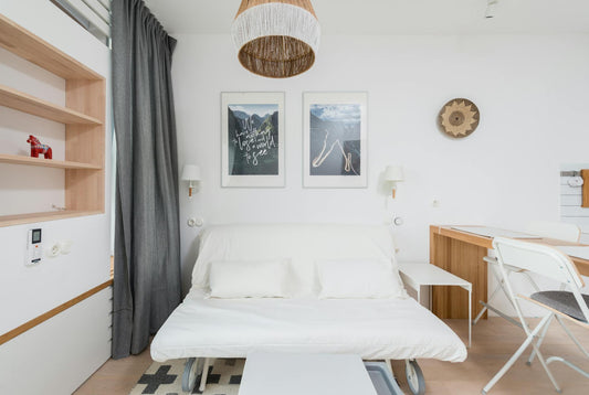 Murphy pull-down bed folded into a wall cabinet in a modern condo - Mattress Miracle Brantford