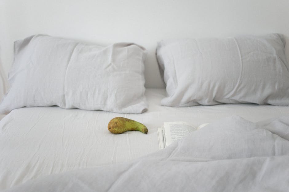 Complete bedding measurements guide showing a neatly made bed with properly sized sheets and duvet