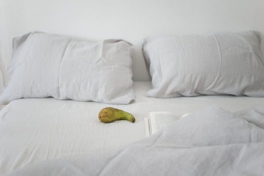Complete bedding measurements guide showing a neatly made bed with properly sized sheets and duvet