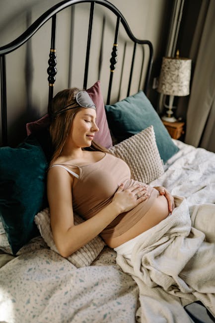 Best pregnancy pillows in Canada 2026 showing woman using maternity support pillow