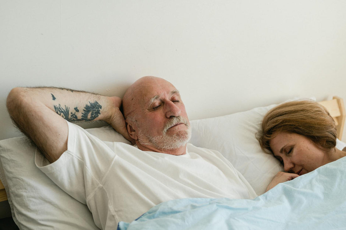 Elderly man sleeping in bed with REM sleep disorder - Mattress Miracle Brantford
