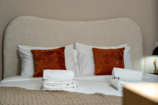 Luxurious resort hotel bedroom with premium white bedding showcasing resort-quality sleep comfort