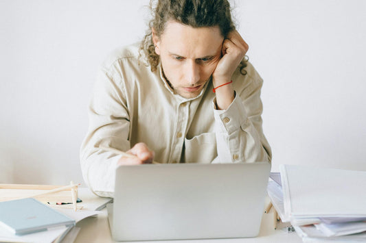 Person experiencing exhaustion and burnout from sleep deprivation - Mattress Miracle Brantford