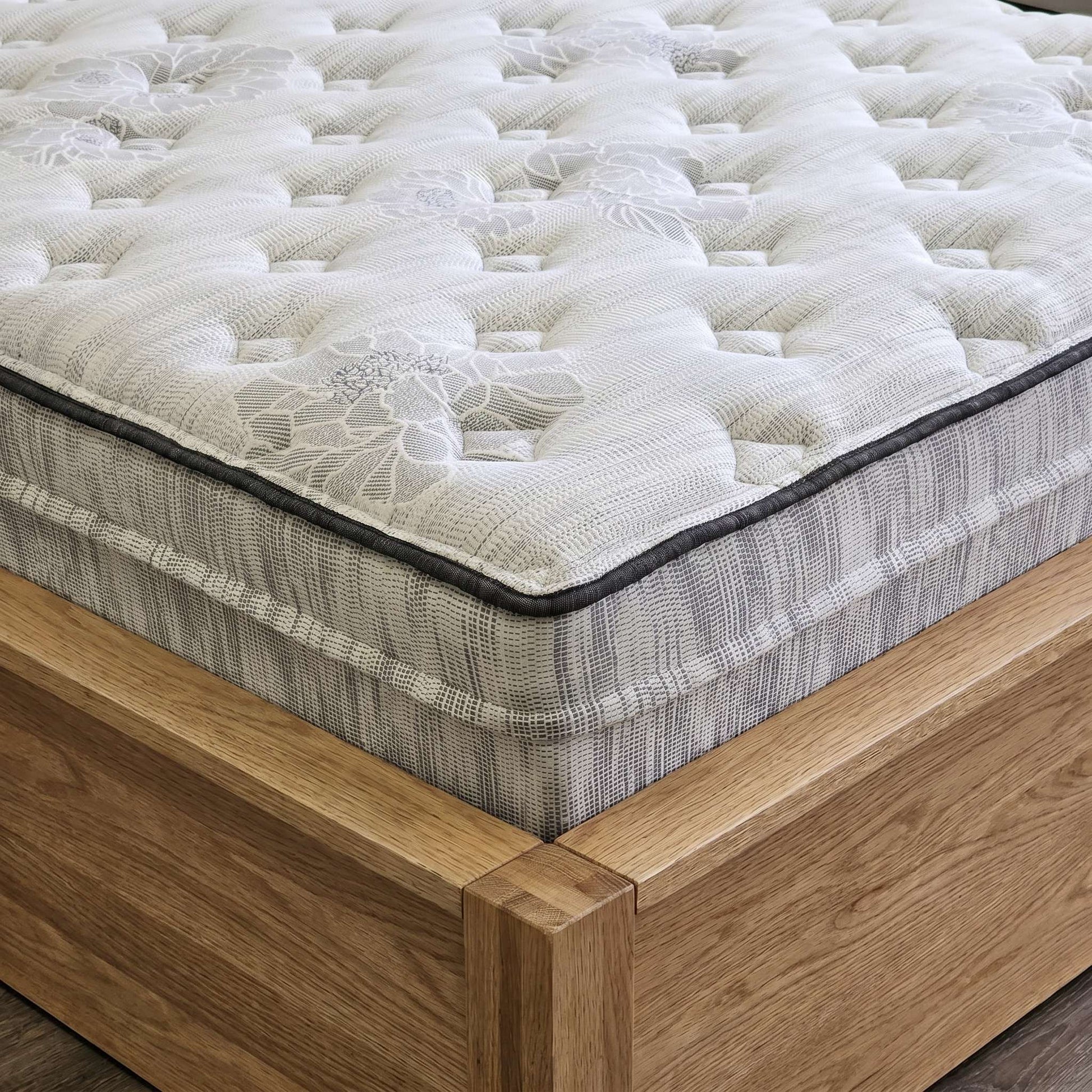 Close-up of the Natura Tranquil's corner, showing the 14-inch edge profile and wrapped coil layer - Mattress Miracle