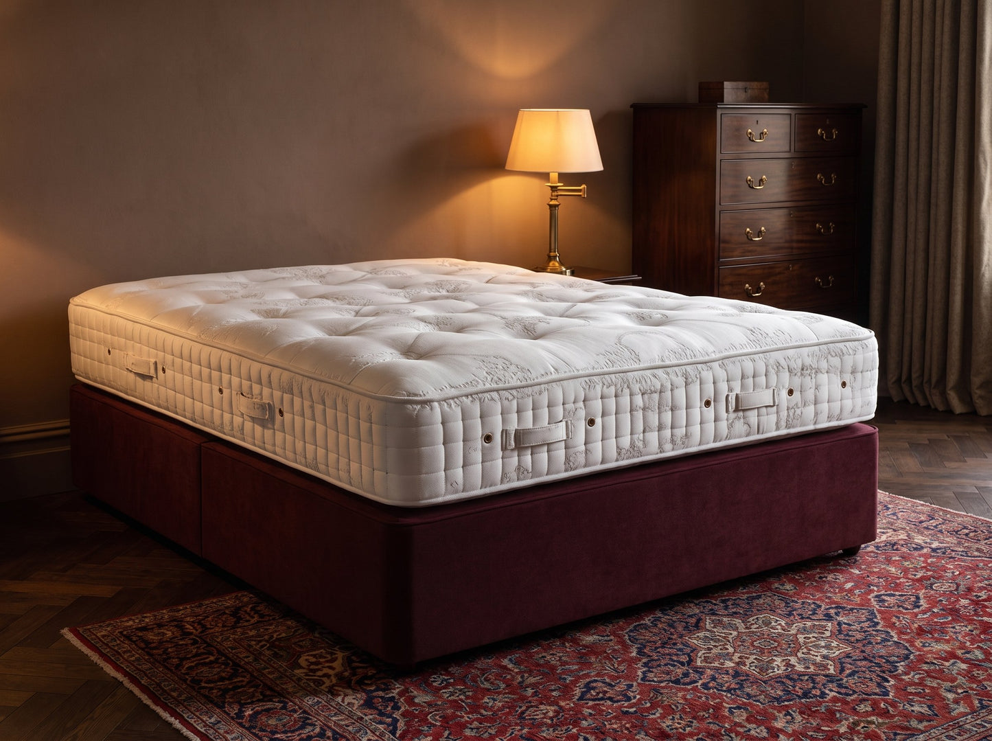 Hypnos Empress mattress styled on a burgundy divan in a heritage bedroom at dusk - Mattress Miracle Brantford