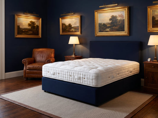 Hypnos Sandringham mattress styled on a navy divan in a stately traditional bedroom - Mattress Miracle Brantford