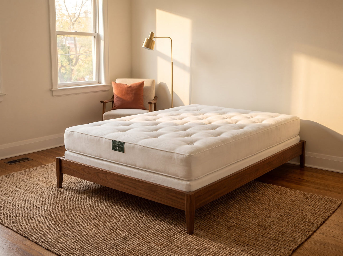 Sprout Durus single-sided medium-firm mattress on a walnut platform bed in warm light