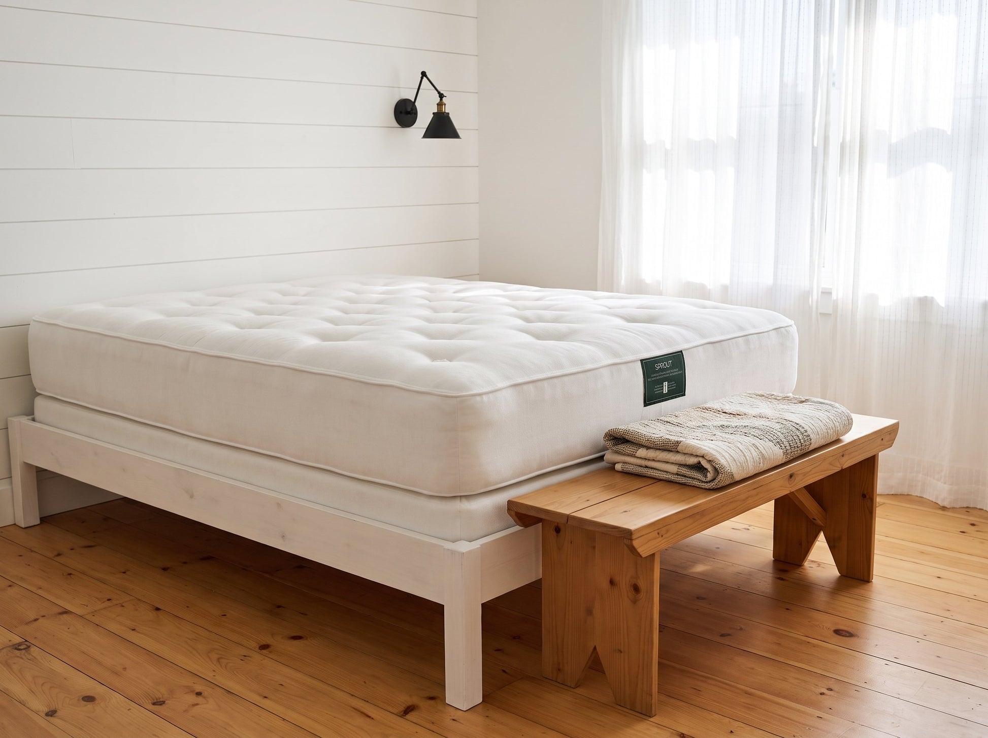 Sprout Durus two-sided natural mattress on a white wood frame in a farmhouse bedroom - Mattress Miracle Brantford