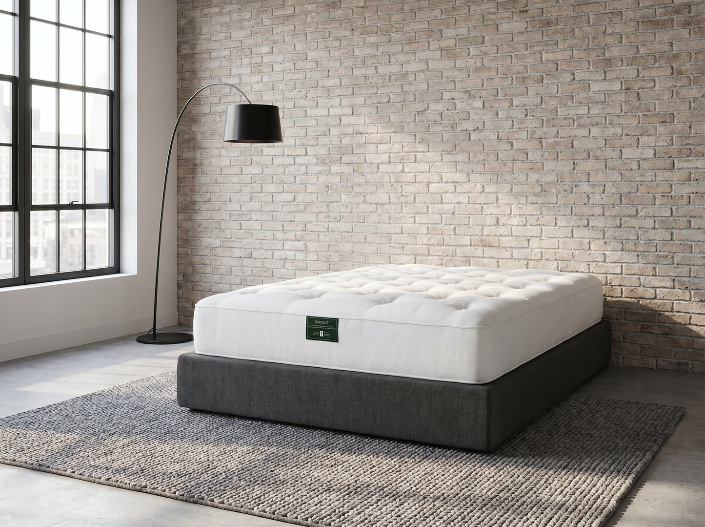 Sprout Firmus two-sided firm mattress on a charcoal platform base in a loft bedroom - Mattress Miracle Brantford