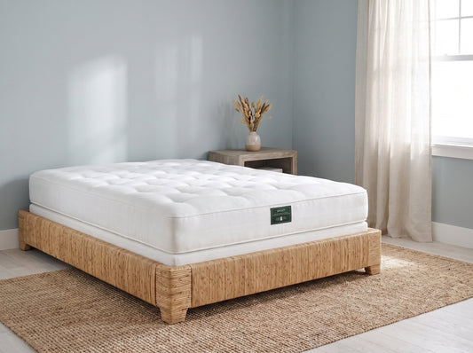 Sprout Somnus two-sided soft mattress on a rattan base in a coastal bedroom - Mattress Miracle Brantford